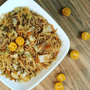 Pancit with some sliced Philippine lime.